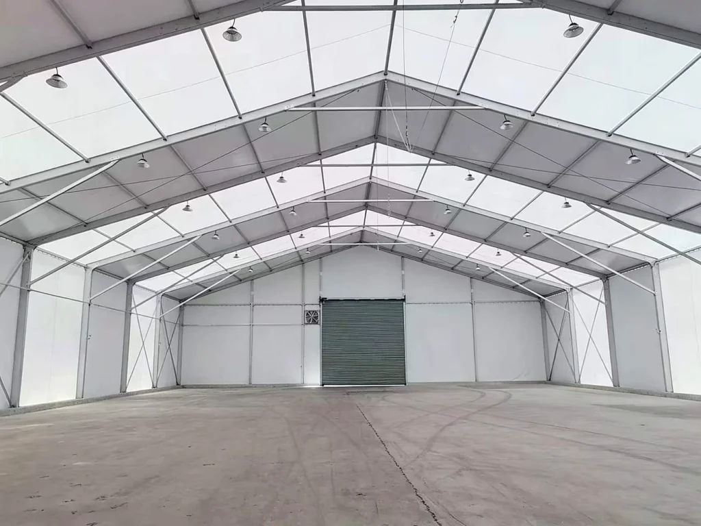 Clear-span interior of an industrial storage tent for mining