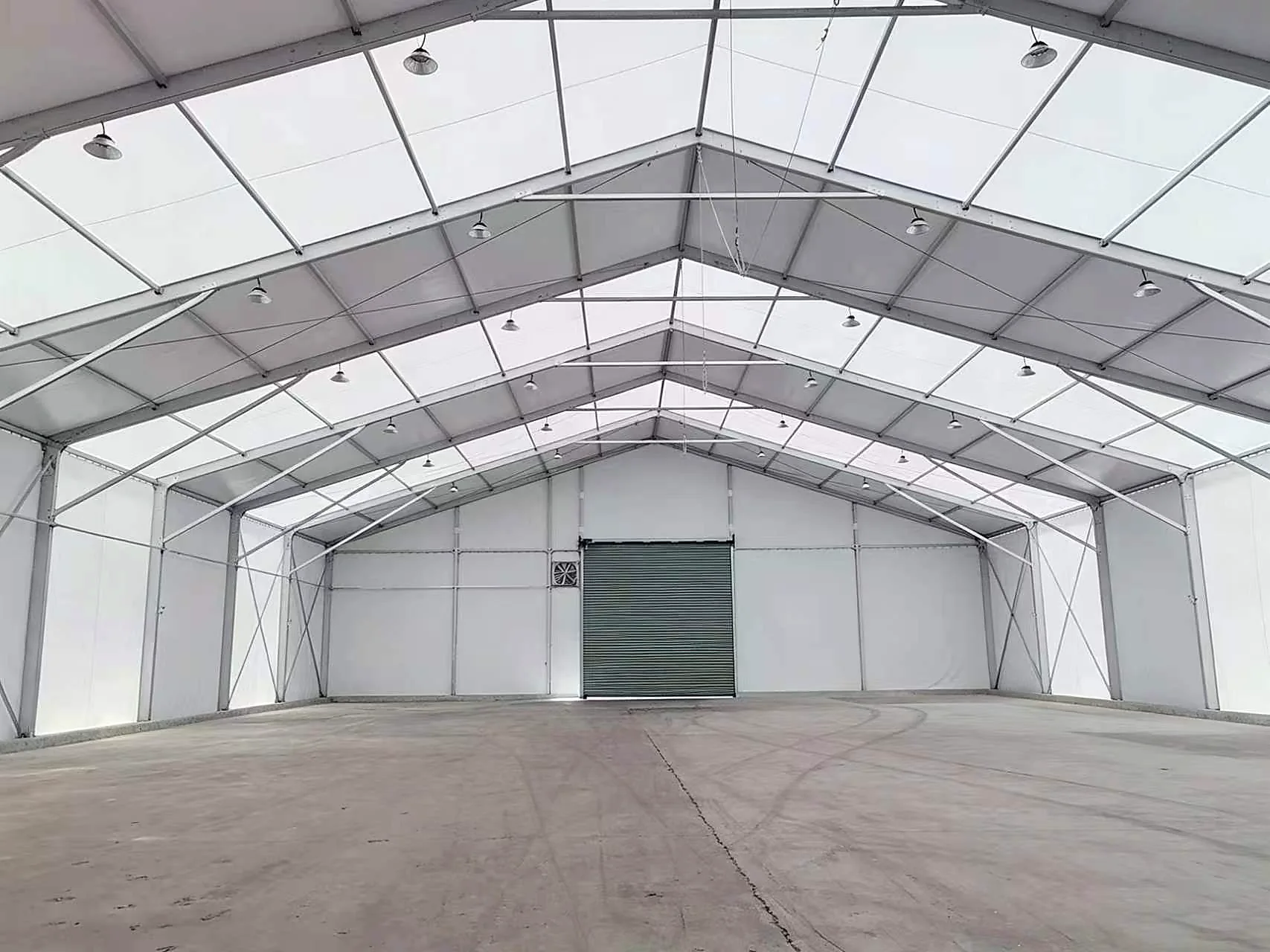 Clear-span interior of an industrial storage tent for mining